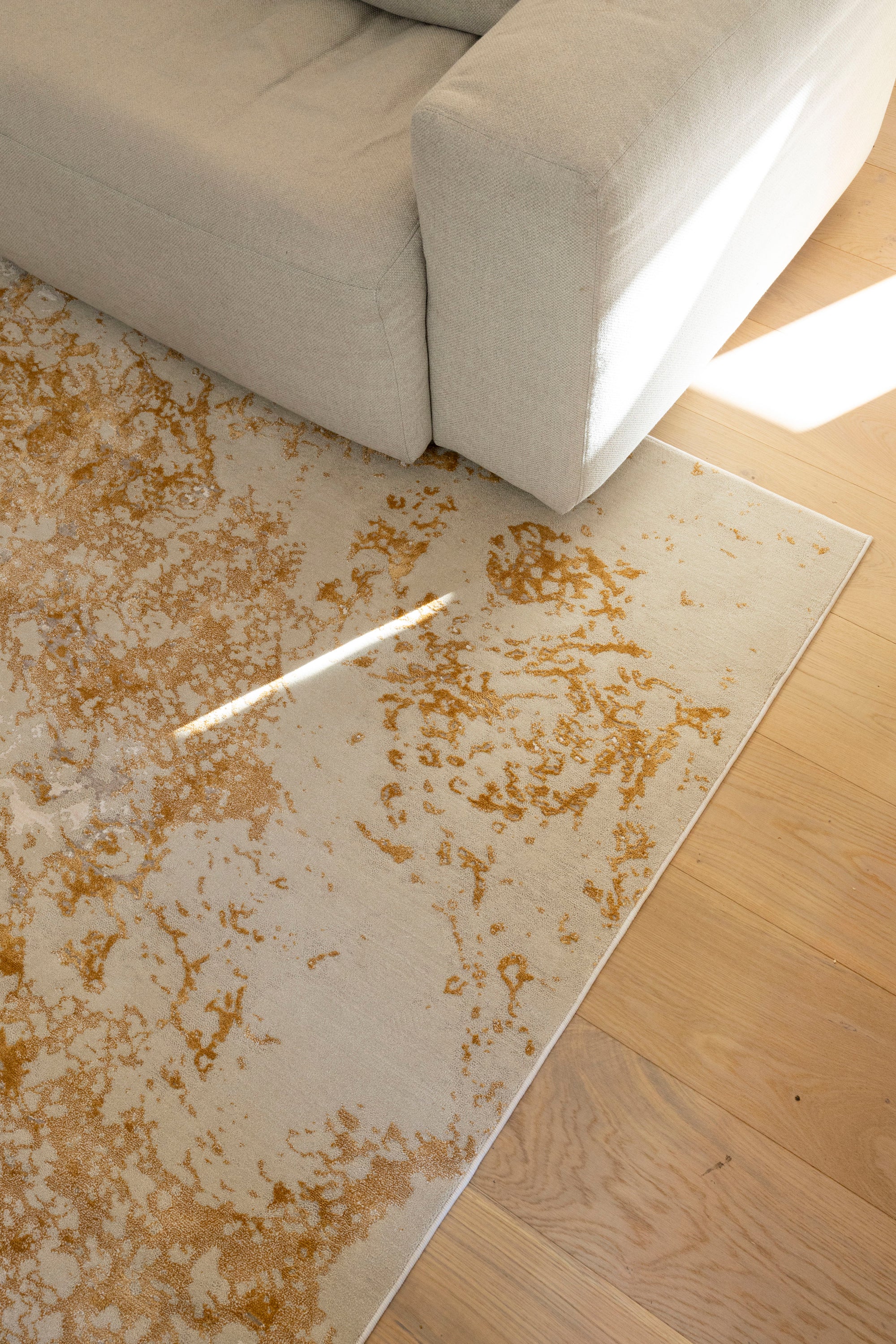 Beige area rug with brownish pattern on Golden Dusk Abstract Rug by Four Corners Rugs