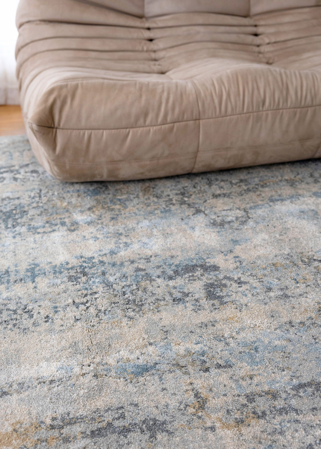 Beige sofa with Cooper Plush Rug by Four Corners Rugs close up