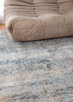 Beige sofa with Cooper Plush Rug by Four Corners Rugs close up