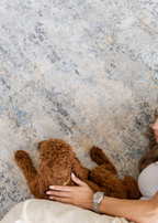 Lady and puppy on Cooper Plush Rug by Four Corners Rugs
