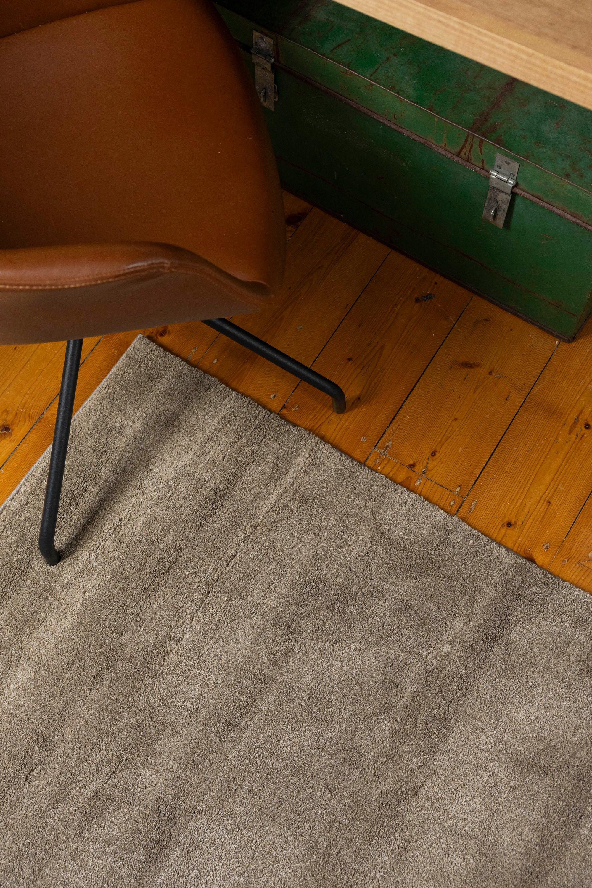 Brown chair on Plush Brown Rug by Four Corners Rugs