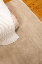 Plush Cream Rug by Four Corners Rugs close up in bedroom