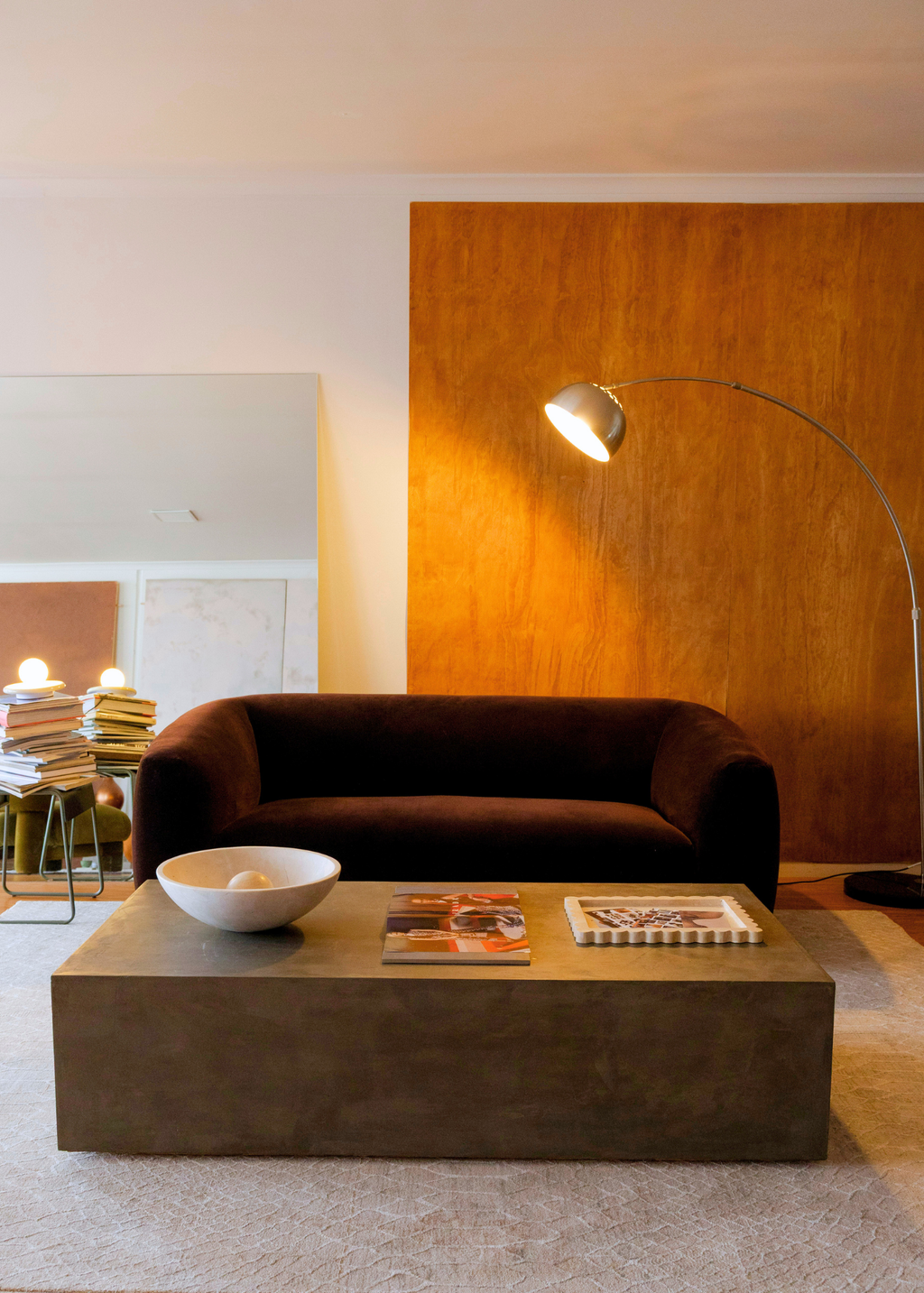 Modern living room with a brown sofa, coffee table, and Python Natural Base Rug