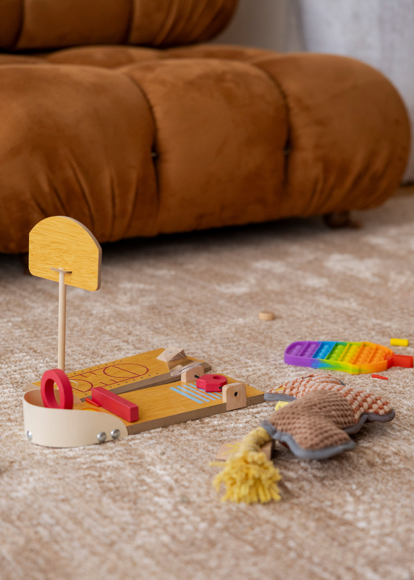 Trinity Biscuit Rug by Four Corners Rugs close up with kids toys
