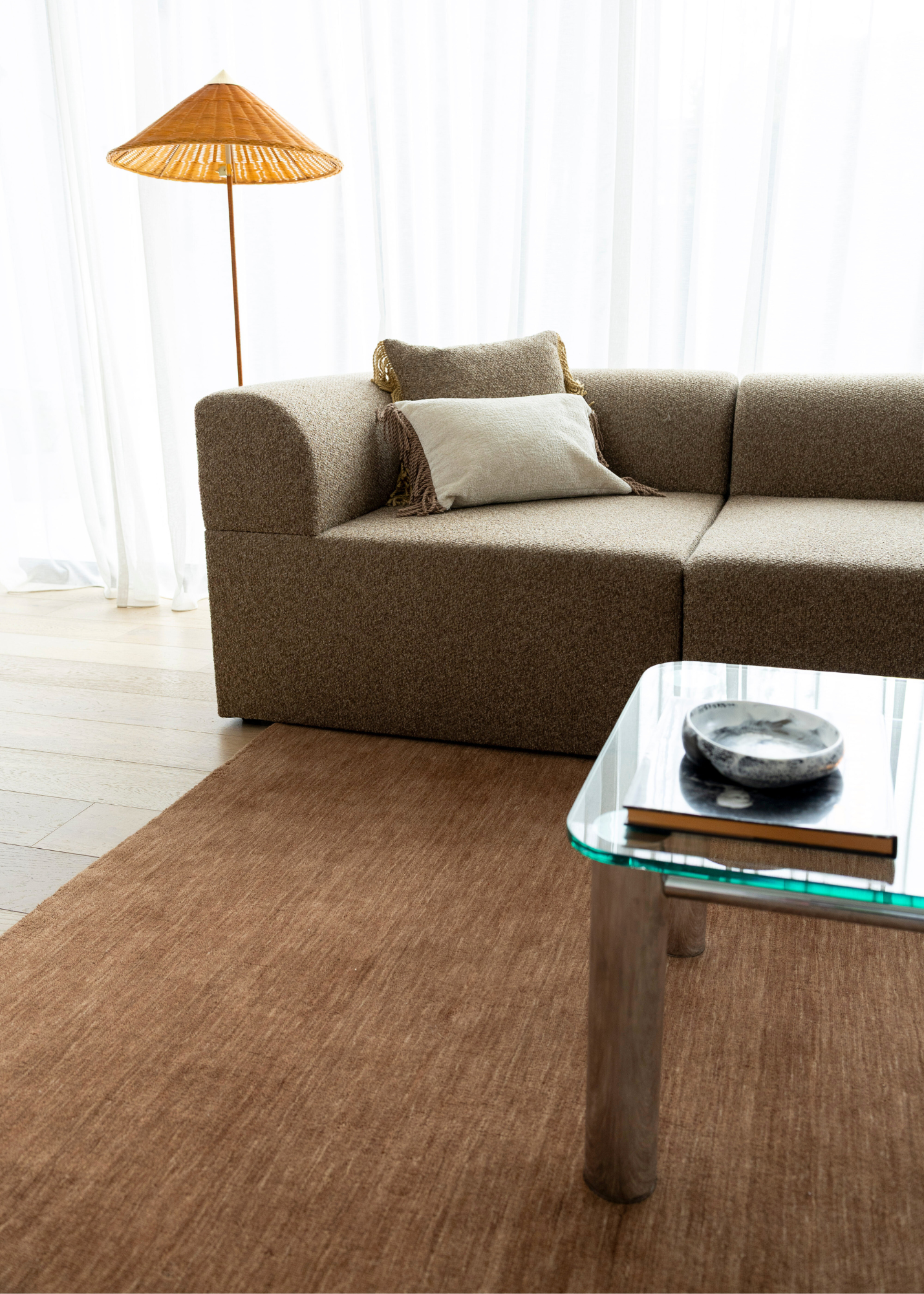 Brown sectional sofa in a living room with Wool Texture Teddy Brown Rug 