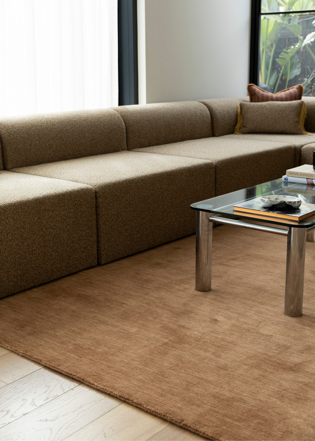 Brown sectional sofa in a modern living room with Wool Texture Teddy Brown Rug 