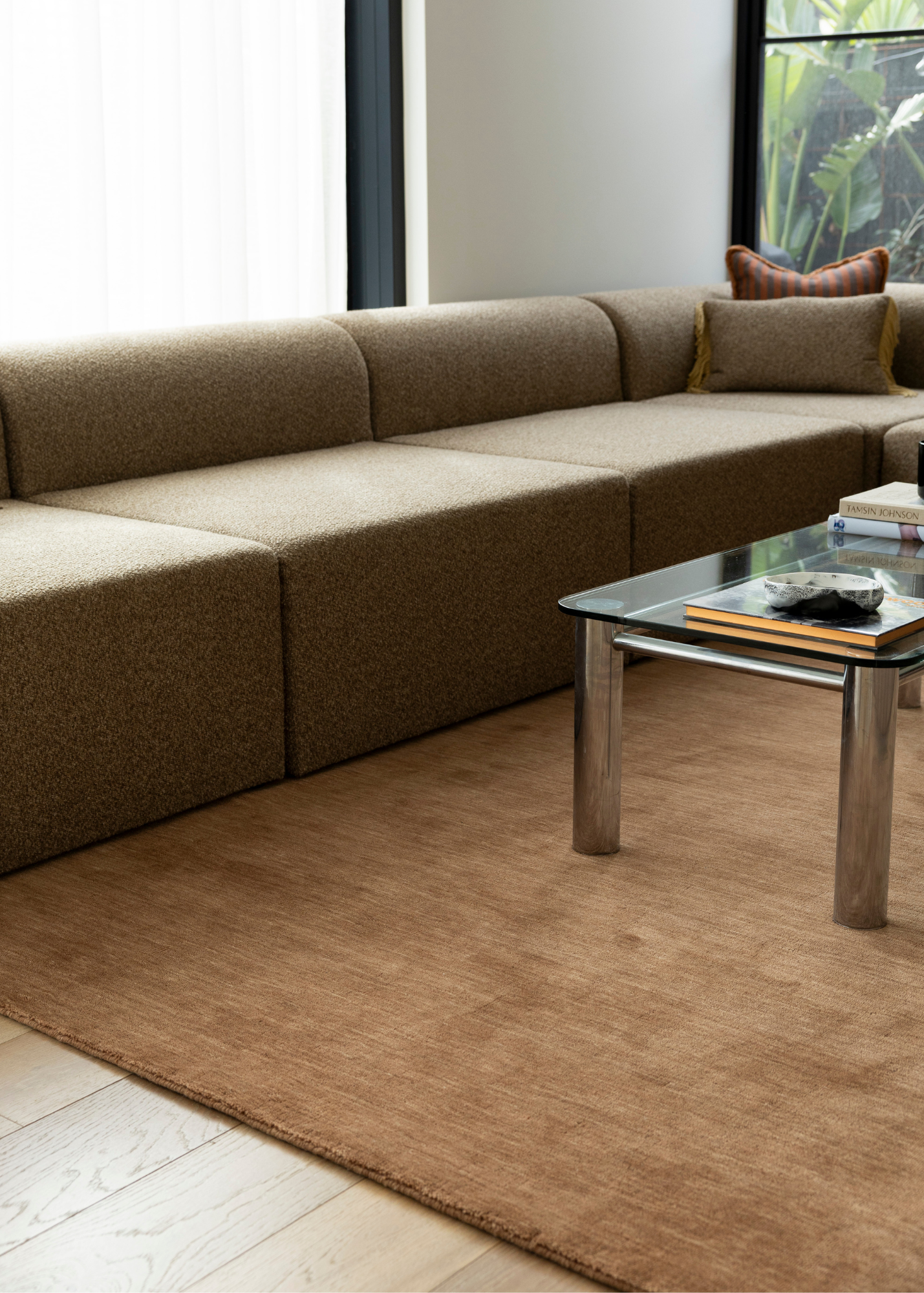Brown sectional sofa in a modern living room with Wool Texture Teddy Brown Rug 