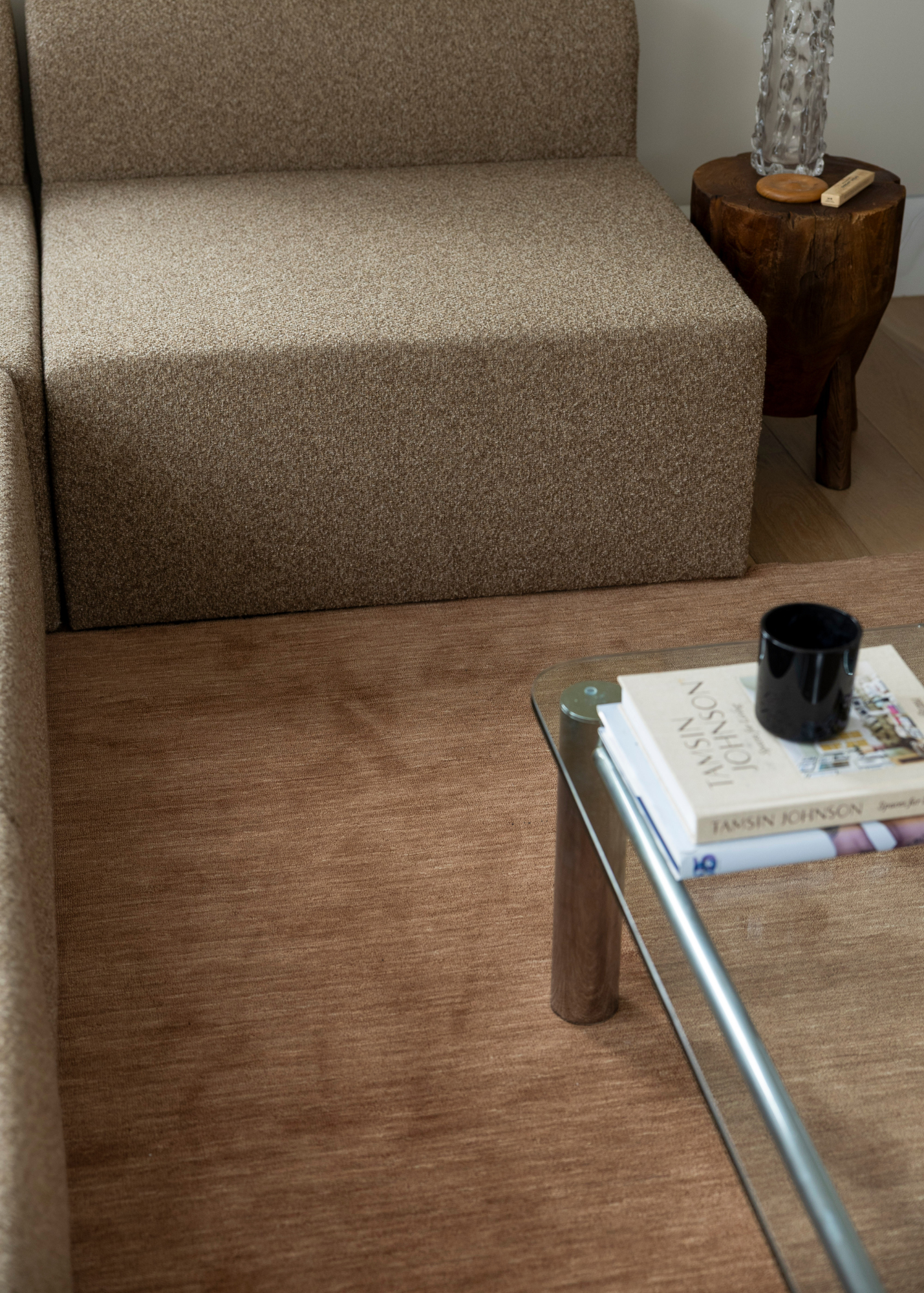 Brown sofa and glass coffee table with Wool Texture Teddy Brown Rug 